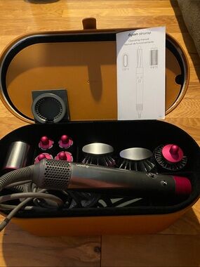 Dyson styler set in gray with pink accents